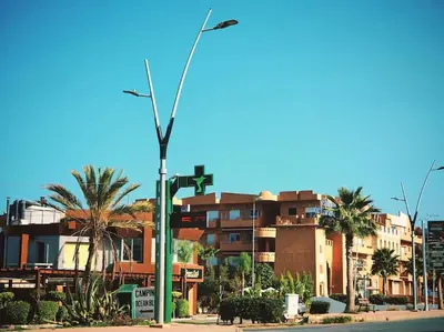 a street light on the side of a street with buildings at Appartement au Bord de Mer in Casablanca
