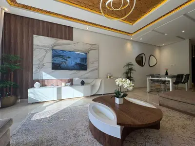 a living room with a couch and a table at 3 Bedroom apartment near Highway with parking in Casablanca