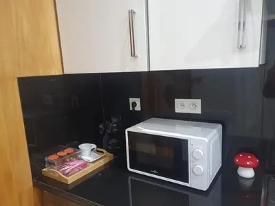 a microwave sitting on top of a counter at 3 Bedroom apartment near Highway with parking in Casablanca