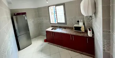 a kitchen with a sink and a refrigerator at appartement neuf top quartier bouskoura a 2 min de l'Hôpital Universitaire International Mohammed 6 in Casablanca