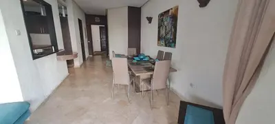 a dining room with a table and chairs at Appartement Beach House 2 Dar Bouazza in Dar Bouazza