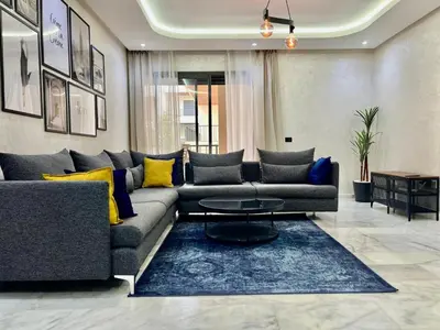 a living room with a couch and a table at M océan in Mohammedia