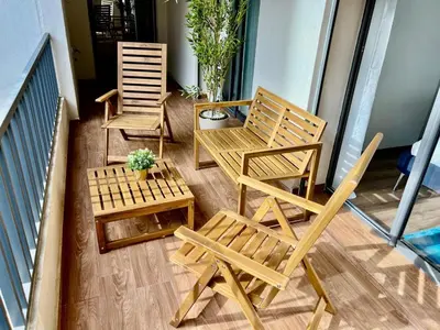 two chairs and a table on a balcony at M océan in Mohammedia