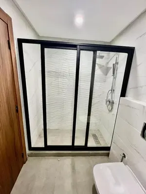 a bathroom with a shower and a toilet at M océan in Mohammedia