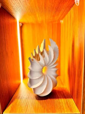 a white vase sitting on the floor of a room at Duplex de luxe avec jardin au coeur de la marina in Casablanca