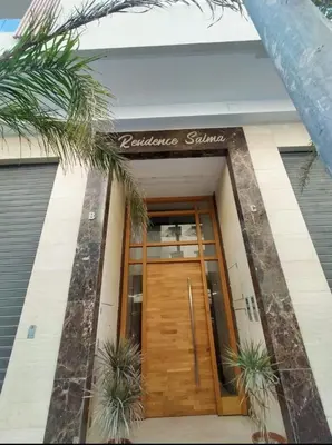 a entrance to a building with a wooden door at Studio Haut Standing, Prix Doux ! in Casablanca
