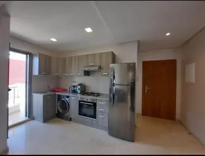 a kitchen with a stainless steel refrigerator and a dishwasher at Studio Haut Standing, Prix Doux ! in Casablanca
