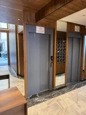 a glass door in a building with a wine cellar at Studio luxueux à Maarif in Casablanca