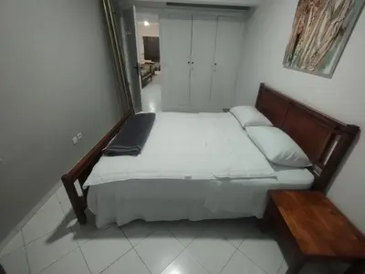 a bedroom with a large bed in a room at Appartement au centre de Rabat Agdal in Rabat