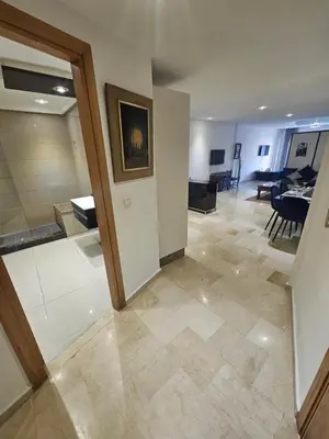 a living room with a kitchen and a dining room at Studio spacieux plein centre in Casablanca