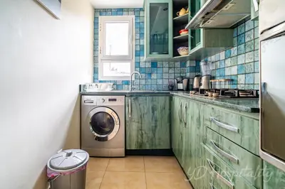 a small kitchen with a washing machine in it at Gauthier 5-Star Luxury Gem in Casablanca