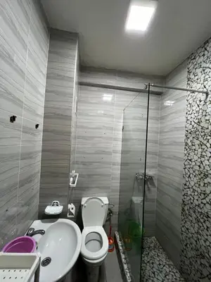 a bathroom with a toilet and a sink at Appartement à Ain Sebaa proche de tous les commodites in Casablanca