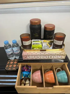 a shelf in a refrigerator with containers and bottles of water at AnfaSuites - Le Central - Parking Free - CasaPort 5min in Casablanca