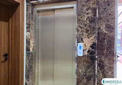 a elevator in a bathroom with a stone wall at Évasion de Charme à El Mansouria in Mansouria