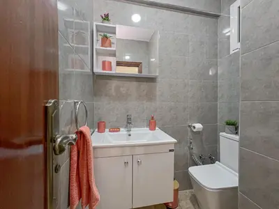 a bathroom with a sink and a toilet at Charmant Appart Moderne au Cœur de Rabat avec Fibre in Rabat