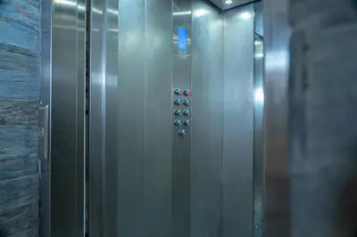 a elevator with a bunch of buttons on a wall at Appart-Hôtel BEL ANFA in Casablanca