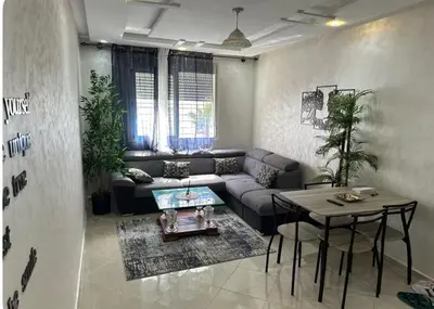 a living room with a couch and a table at Surf appart Darb in Casablanca