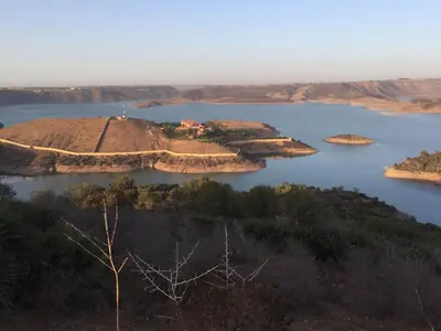 an island in the middle of a body of water at premium farmhouse with pool Rabat in Rabat