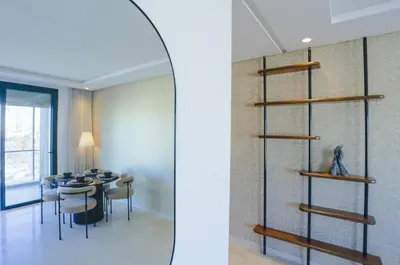 a dining room with a table and a shelf at Résidence Tour 33 - CFC district in Casablanca