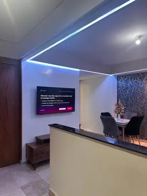 a bar with a table and a sign on the wall at Studio au cœur du centre ville de Casablanca in Casablanca