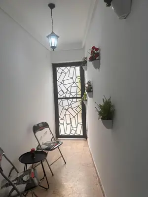 a room with a table and chairs and a window at Studio au cœur du centre ville de Casablanca in Casablanca