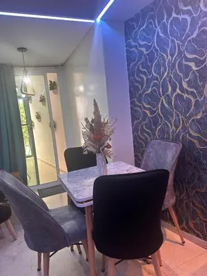 a dining room with a table and chairs at Studio au cœur du centre ville de Casablanca in Casablanca