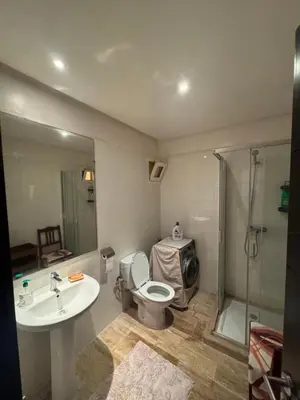 a bathroom with a toilet and a sink and a shower at Chill by Sea-Relaxing Stay with a View in Rabat
