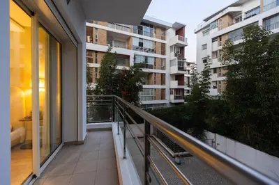 an apartment balcony with a view of a building at Modern & Chic APT Prestigia by MERAT HOME in Rabat