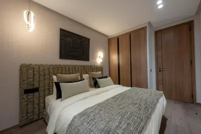 a bedroom with a large bed in a room at New - Cosy central Casablanca apartment in Casablanca