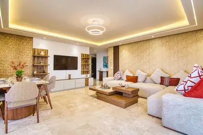a living room with a couch and a table at BlueVista - Yacht like Escape with Ocean Views in Rabat