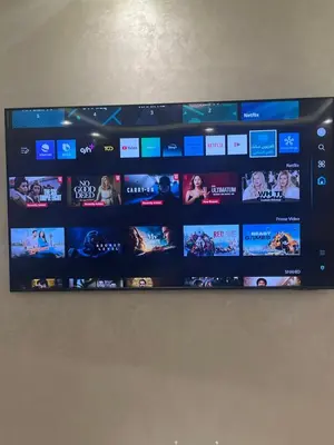 a wall with a bunch of television screens at Ma Raffiné Ziraoui in Casablanca