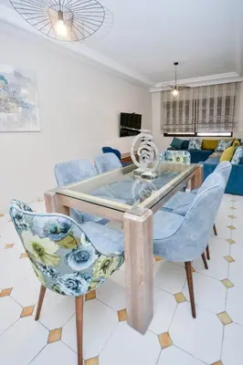 a living room with a glass table and chairs at Cozy 2 BR Gauthier Oasis in Casablanca