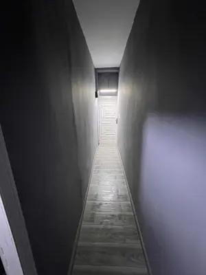 a hallway with a white door and a hallwayngth at Organizado apartamento 2 in Mediouna