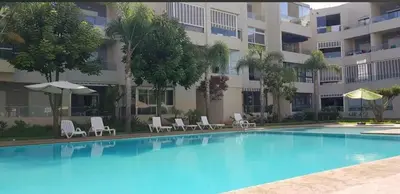 a large swimming pool in front of a building at La perle in Pont Blondin