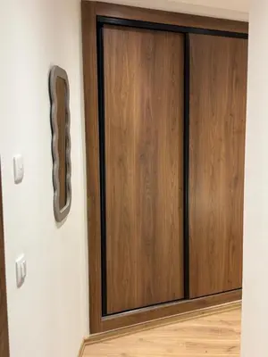 a wooden door in a room with a wooden floor at NEW apartment heart of Rabat city center in Rabat