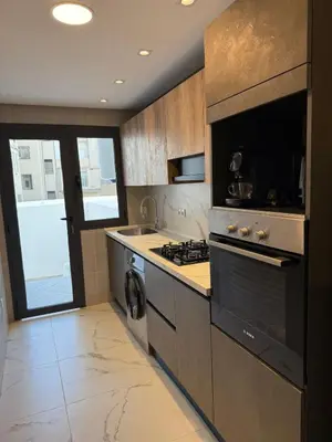 a kitchen with a stove and a sink at NEW apartment heart of Rabat city center in Rabat