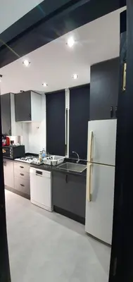 a kitchen with a white refrigerator and a sink at Cozy Apartement B-House Airport in Berrechid