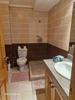 a bathroom with a toilet and a sink at Baghdad 4 in Aïn Harrouda