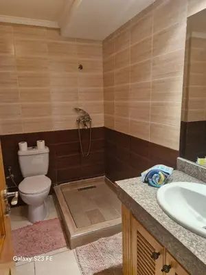 a bathroom with a toilet and a sink at Baghdad 4 in Aïn Harrouda