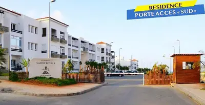 a street with a gate in front of a building at Bel Appartement à louer à Mansouria in Pont Blondin