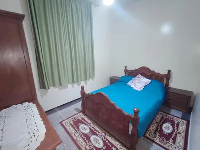 a small bedroom with a blue bed and a window at de Luxe in Rabat