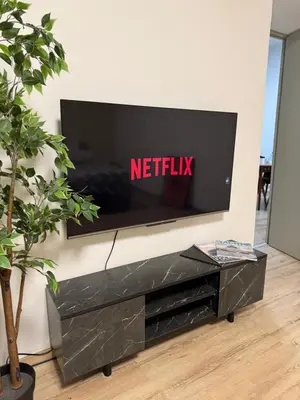 a tv on a wall with a netflix sign on it at Spacious Apartment Entire Villa Floor 2 Bedrooms in Rabat