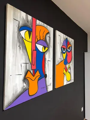 a group of three paintings on a wall at Spacious Apartment Entire Villa Floor 2 Bedrooms in Rabat