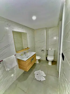 a bathroom with a sink and a toilet at Oscar Hotel in Rabat