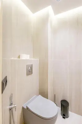 a bathroom with a white toilet in a room at Luxury Central 3BR 5min from Beach & Shopping in Casablanca