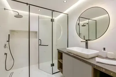 a bathroom with a sink and a mirror at Luxury Central 3BR 5min from Beach & Shopping in Casablanca