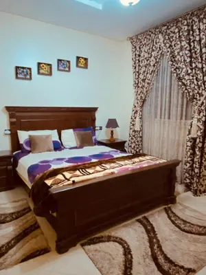 a bedroom with a bed and a window with curtains at Luxurious Holiday Home2 in Temara