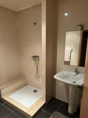 a bathroom with a shower and a sink at Appartement haut standing Mohammedia Parc in Mohammedia