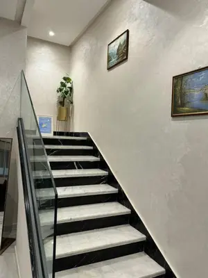 a staircase in a building with a stair case at Emma's Duplex in Casablanca
