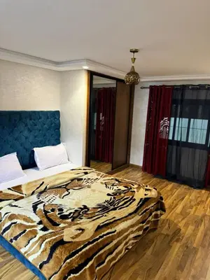 a bedroom with a tiger blanket on a bed at Emma's Duplex in Casablanca